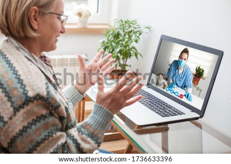 Elderly caucasian woman interacting with young female doctor via chat video call,medical worker seeing patient in virtual house call,telemedicine during pandemic and on demand medical service concept  Royalty-Free Stock Photo #1736633396