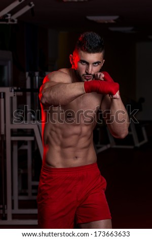 Strong Muscular Mixed Martial Arts Fighter - Muscular Boxer MMA Fighter Practice His Skills