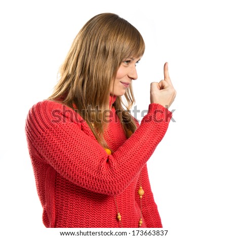 young girl making horn gesture over white background 