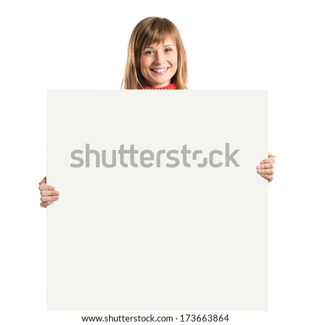 Young blonde girl holding placard