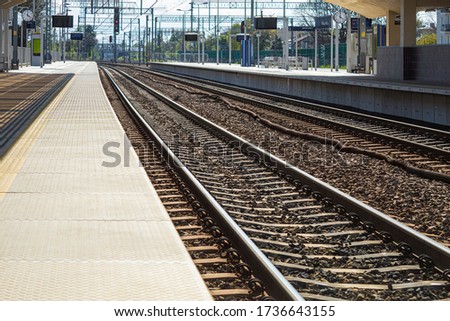 Station platform and railway tracks