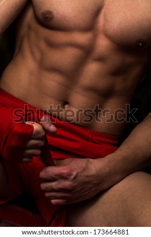 Kick Boxer Getting Ready - Muscled Boxer Wearing Red Strap On Wrist