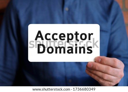 Acceptor domains - text on a white sign in the hand of a man in a blue shirt