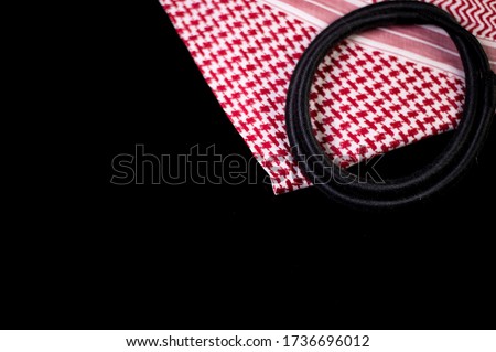 Ghutrah also known as Keffiyeh or Shmag along with the agal and skull cap. These items of clothing are usually worn by men as a traditional head-dress in Arab Countries especially in Saudi Arabia. Royalty-Free Stock Photo #1736696012