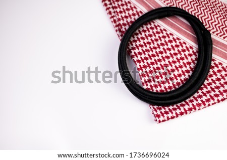 Ghutrah also known as Keffiyeh or Shmag along with the agal and skull cap. These items of clothing are usually worn by men as a traditional head-dress in Arab Countries especially in Saudi Arabia. Royalty-Free Stock Photo #1736696024