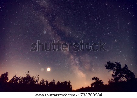 Spring Milky Way and satellite light in the night sky.
