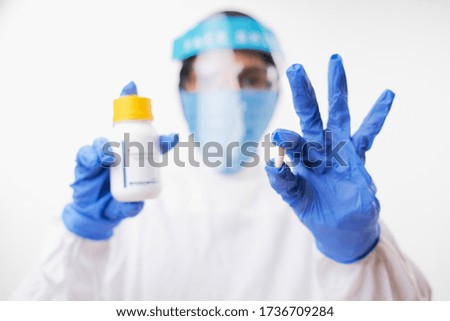 Female doctor holding Hydroxychloroquine (Chloroquine) Medicine for coronavirus treatment