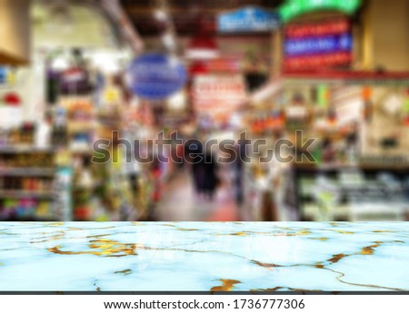 Marble top table on blur supermarket background