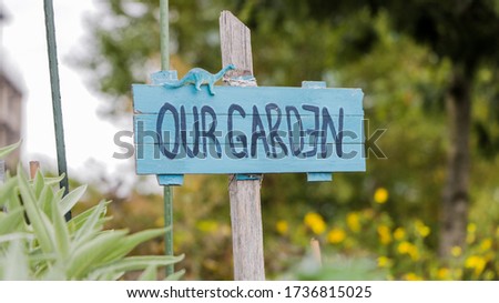 Garden sign that reads our garden