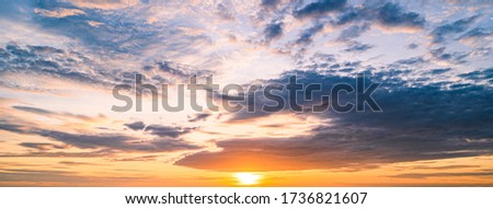 Beautiful sunset sky with clouds background,Banner cover panoramic concept background.
