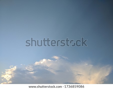 beautiful clouds in a clear sky with sunlight.