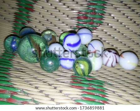 Marbles are one of the most popular children's toys, especially for boys.Marbles are small, round-shaped toys made of glass. The size of marbles varies greatly, generally ½ inch (1.25 cm)  