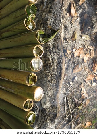 Glutinous rice is wrapped with banana leaf encased in bamboo culm and cooked in open fire called "Lemang ". It is a traditional Malay household, eaten with beef or chicken rendang during Hari Raya.