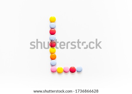 Candies font alphabet. Letter L isolated top view