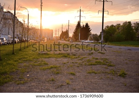 Photo of sunset sun in summer outdoors city