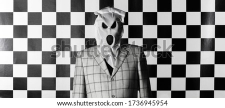 men in scary white mask on a black and white background