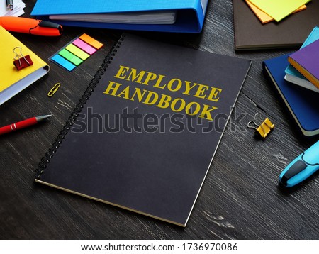 Employee handbook and papers with rules and procedures. Royalty-Free Stock Photo #1736970086
