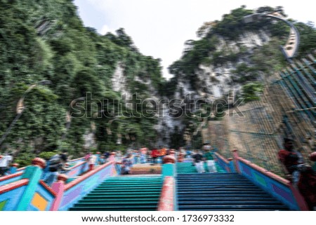 motion blurred visitors at hindu temple in kuala lumpur, malaysia
