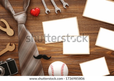 Father's day concept with empty photo frames for mockup over wooden background. top view, flat lay