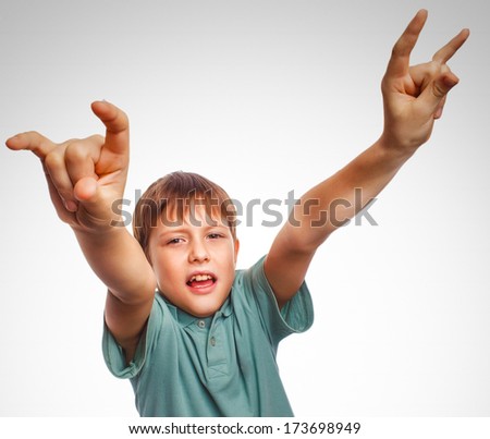 teenager boy kid shows gesture hands metal rock devil isolated on white background gray large
