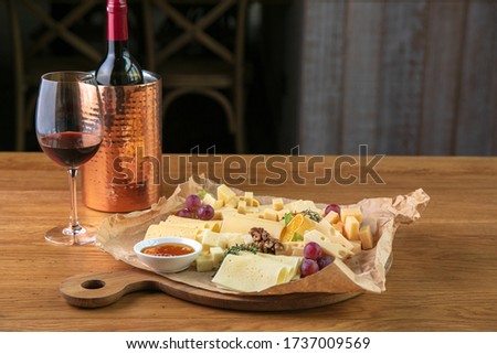 Gourmet dinner with cheese and wine in the restaurant. Romantic dinner.