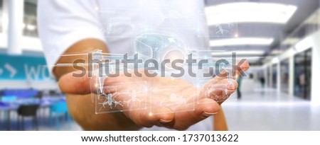 Businessman on blurred background holding and touching holographic drone projection in his hands 3D rendering