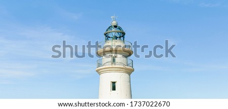 Panoramic lighthouse on blue sky in summer time. Concept: vacations, summer.