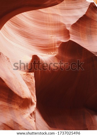 Selective focus detail of colorful sandstone formation curve wall at Antelope Canyon