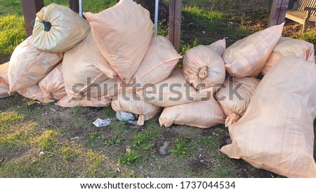 Picture of a sack of garbage being thrown away