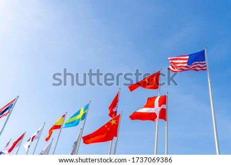 Flagpole international global with blue sky background 
