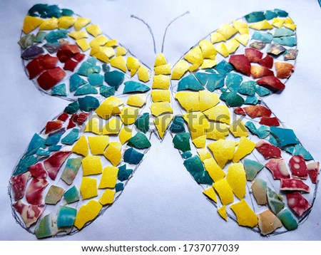 Butterfly multicolored on a light background