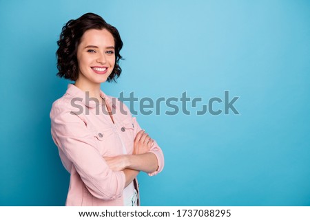 Profile photo of attractive pretty lady short black hairdo self-confident business woman arms crossed friendly beaming smiling wear casual pink denim jacket isolated blue color background Royalty-Free Stock Photo #1737088295