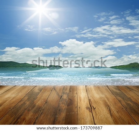 brown wooden pier over ocean and sky 