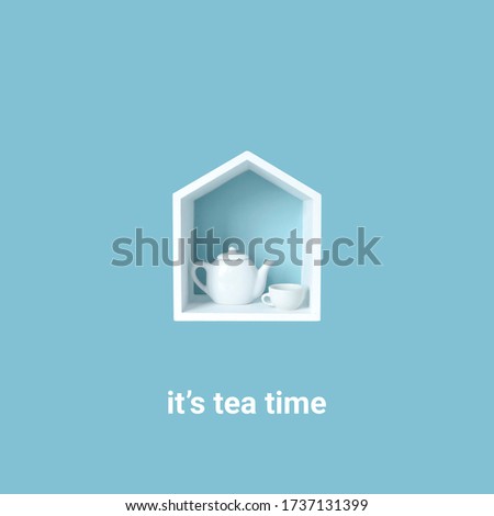 its tea time lettering on a lightbox with small white wooden house with a teapot and cup isolated on a blue background