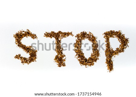 Stop sign made of tobacco for cigarettes on a white background, harm, Smoking ban.