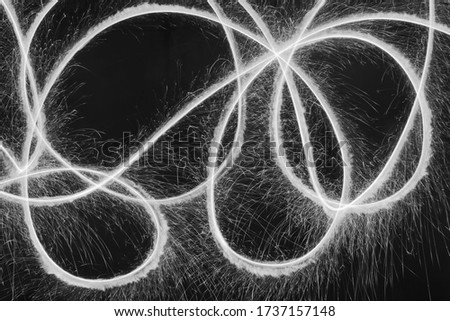 Abstract Black and white sparkle light painting background