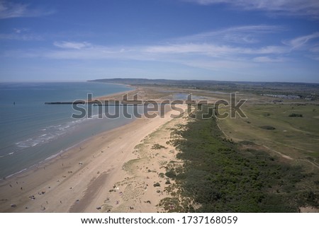 beautiful beach aerial view of camber sands bay, sand dunes countryside and beach coastal view.  