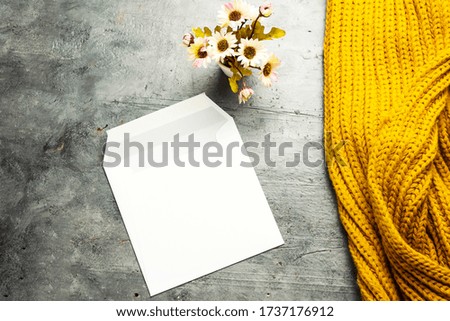 White envelope mock-up, blank template and scarf on gray background
