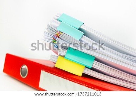 red folder with paper file retention of contracts on white background, concept Office supplies