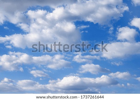 Blue sky with white clouds. The concept of the ozone layer, protection of nature, clean air.