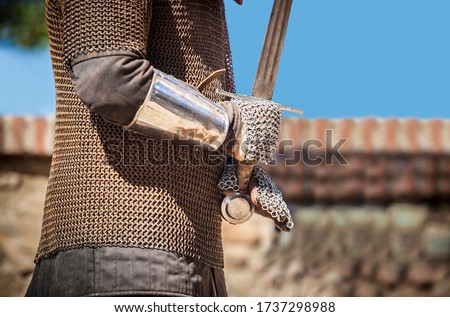 Reconquest warrior covered  with chain mail mittens or muffs. He is gripping the sword Royalty-Free Stock Photo #1737298988