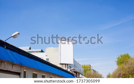 Blank billboard on the building. Blank template for outdoor advertising, mock up