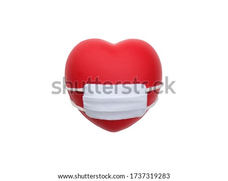 Red heart wearing white mask isolated on white background with copy space. Concept for healthcare insurance, coronavirus self quarantine, or support for medical staff.