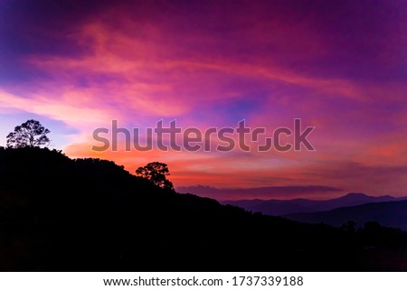 Beautiful Sky Silhouette Sunset at Mountain Hill in the Evening Twilight Time. Peaceful Concept with Copy Space.