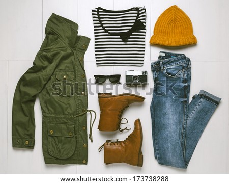 Overhead of hipster woman essentials. Outfit of casual woman.  Royalty-Free Stock Photo #173738288