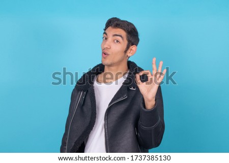 young expressive male model isolated on color background
