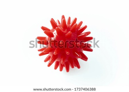 Red covid-19 virus and bacteria in the form of a red ball with spikes and needles on a white background. Concept of health care and medicine during the period of quarantine and infection of people