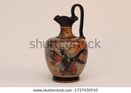 
photograph of an Egyptian vase on a white background