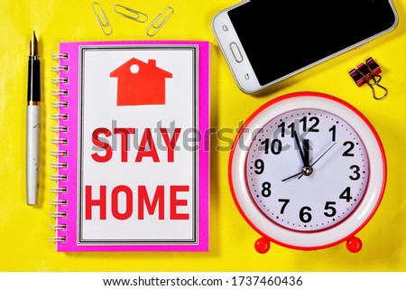 Stay home-the text is written on a Notepad. Backed up by personal example. Work from home, Internet activity on your computer and phone remotely from the office.