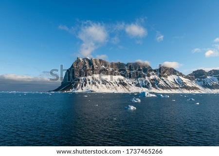 Arctic landscape with sea and mountains in Svalbard, Norway